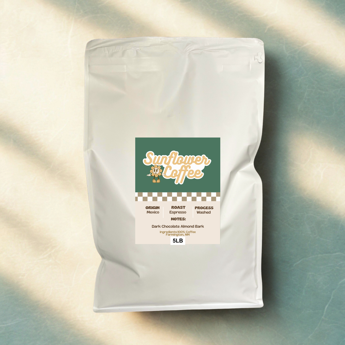 White coffee bag with a label on a textured surface