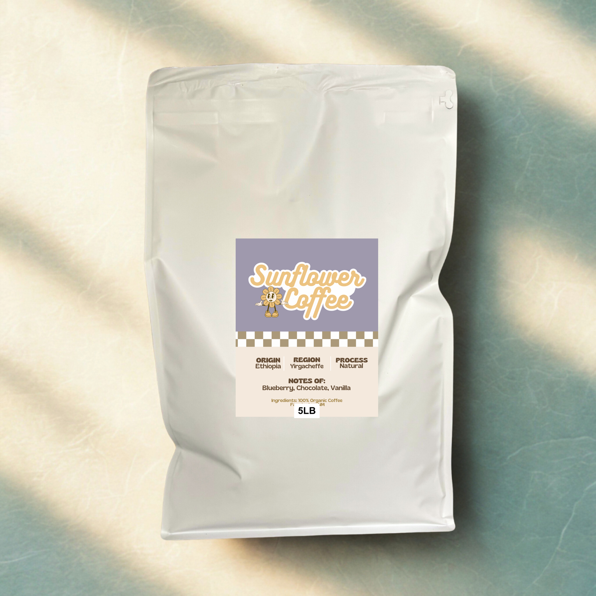 White coffee bag with a label on a textured surface