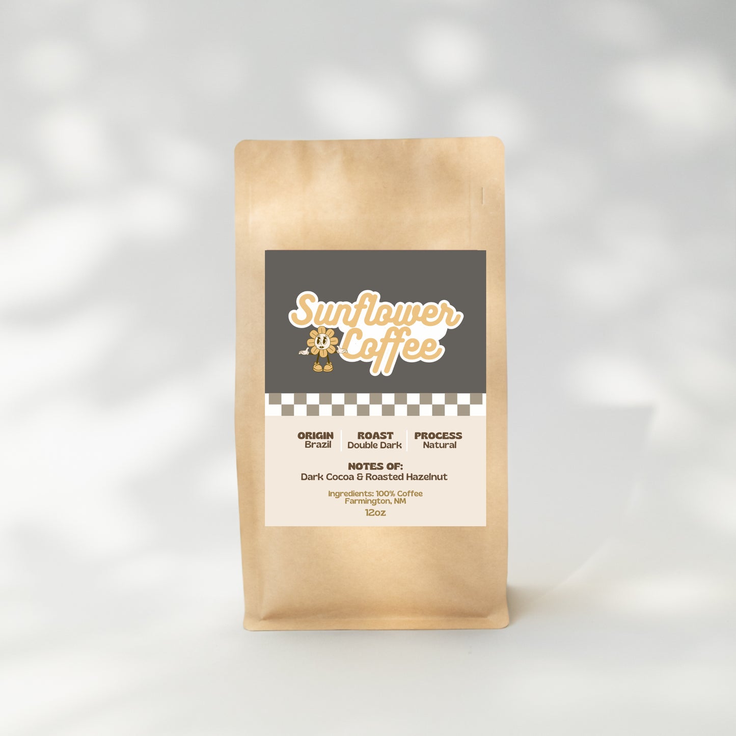 Kraft paper coffee bag with 'Sunflower Coffee' label on a light gray background
